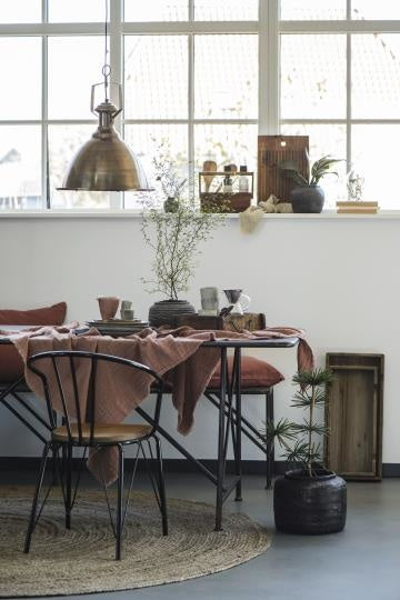 Rust-colored plaid doppeltgewebt tablecloth on rustic dining table with unique Wohndeko and individual style accents. - Plaid doppeltgewebt ziegel