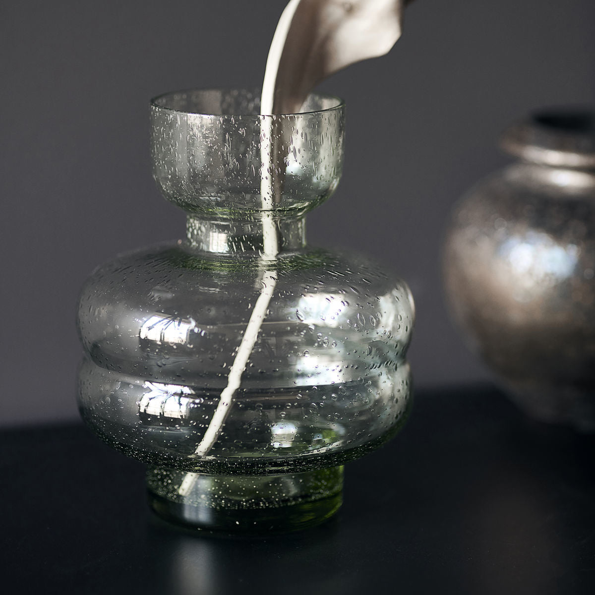 Unique green glass vase with textured surface, perfect for Wohndeko and individual style. - Vase Organi green