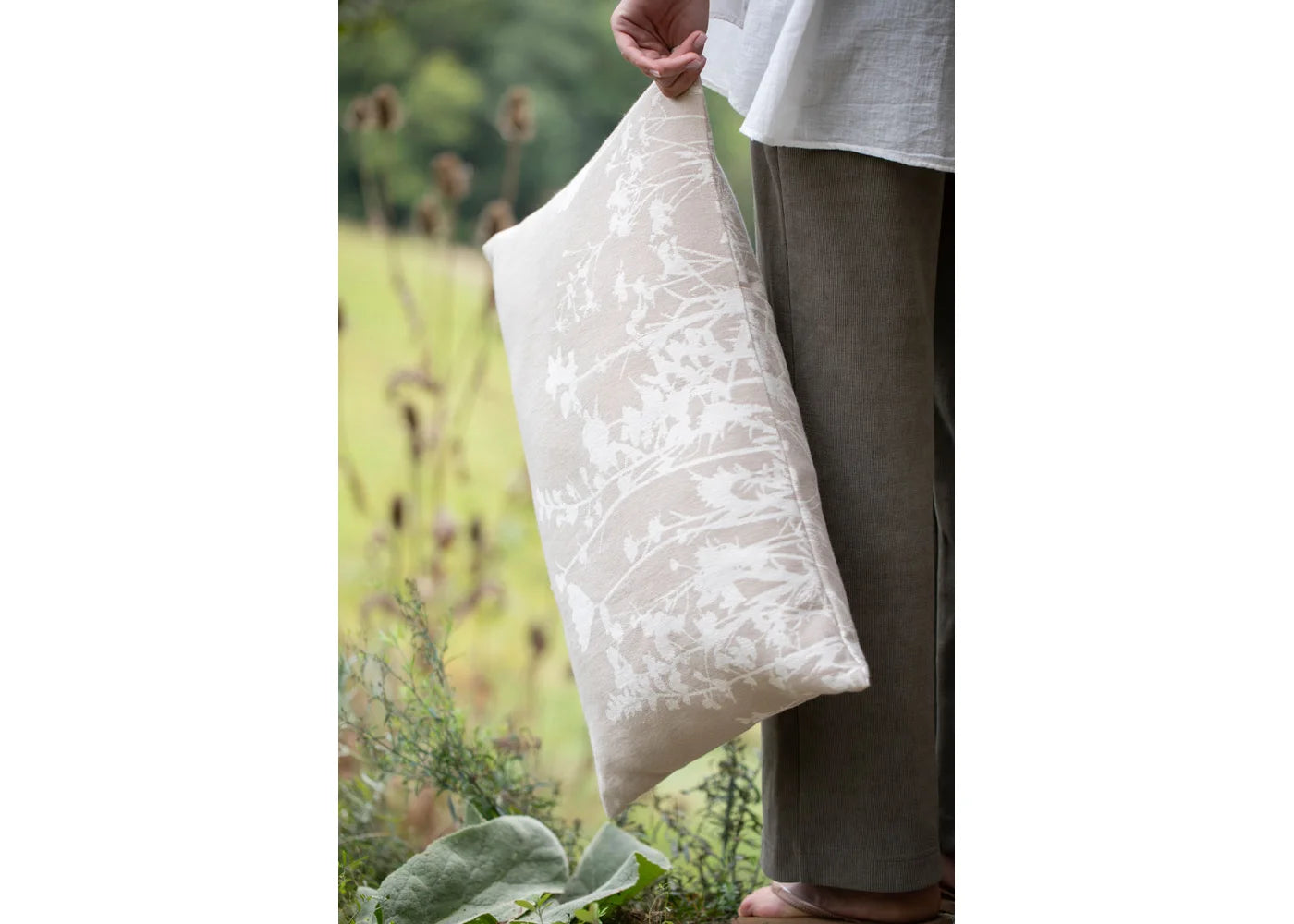 Beige cotton pillow cover with unique floral pattern, soft texture, ideal for individual style and favorite home decor pieces. - PORTO Kissenhülle Blumen natur