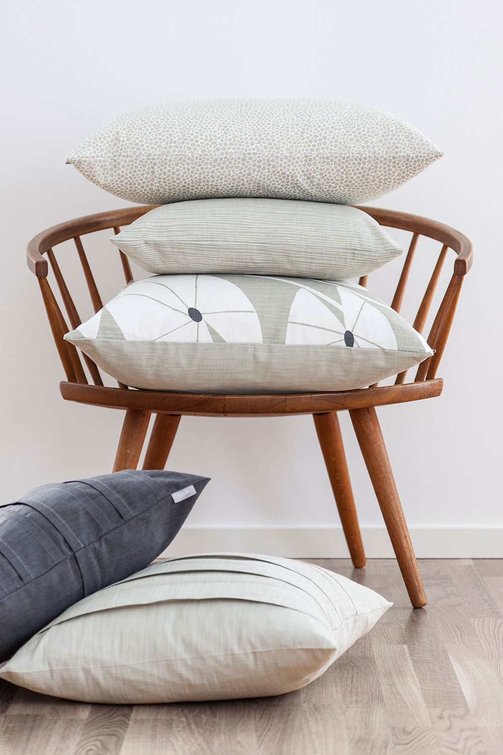 Stack of unique linen cushion covers in neutral tones with minimalist line designs, perfect for individueller Stil and. - LINE Cushion Cover linen